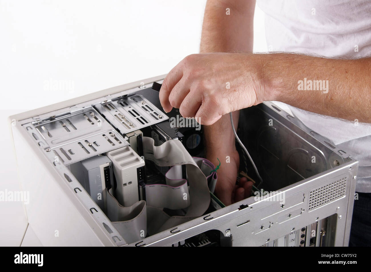 Dman Reparing Computer man reparing a PC Stock Photo - Alamy