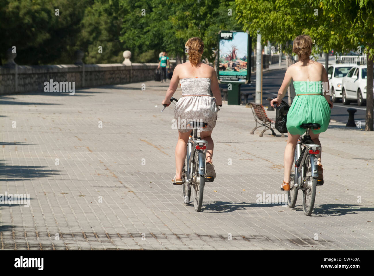 Tourists ride their bikes around town and Valencia Stock Photo