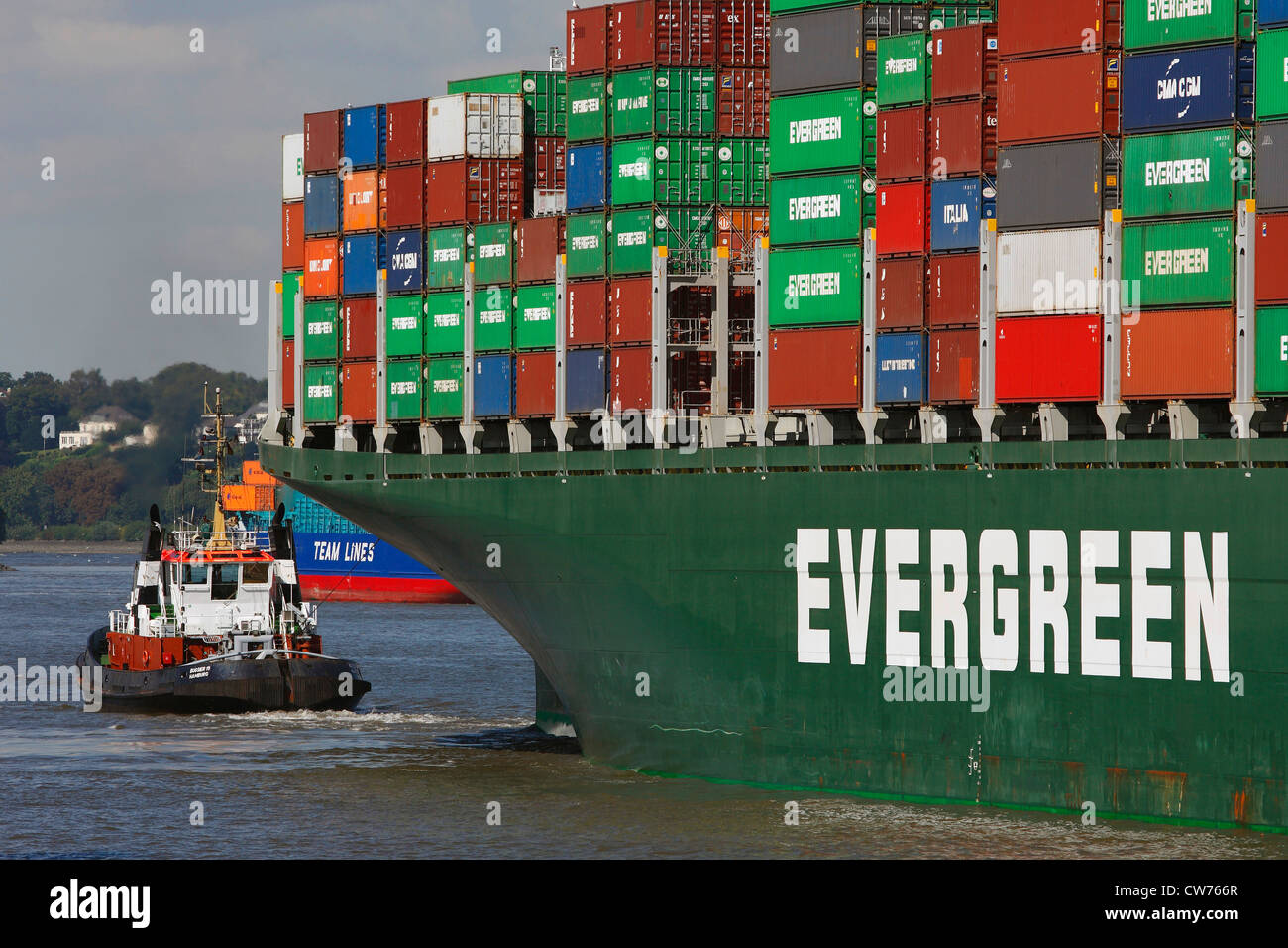 tugboat and container ship in Port of Hamburg, Germany, Hamburg Stock Photo