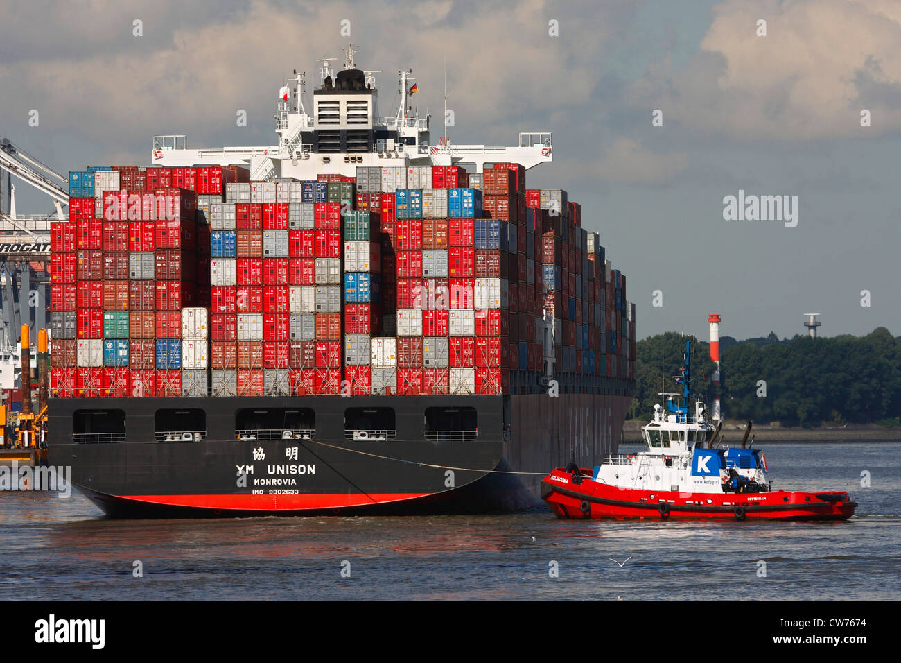 tugboat and container ship in Port of Hamburg, Germany, Hamburg Stock Photo