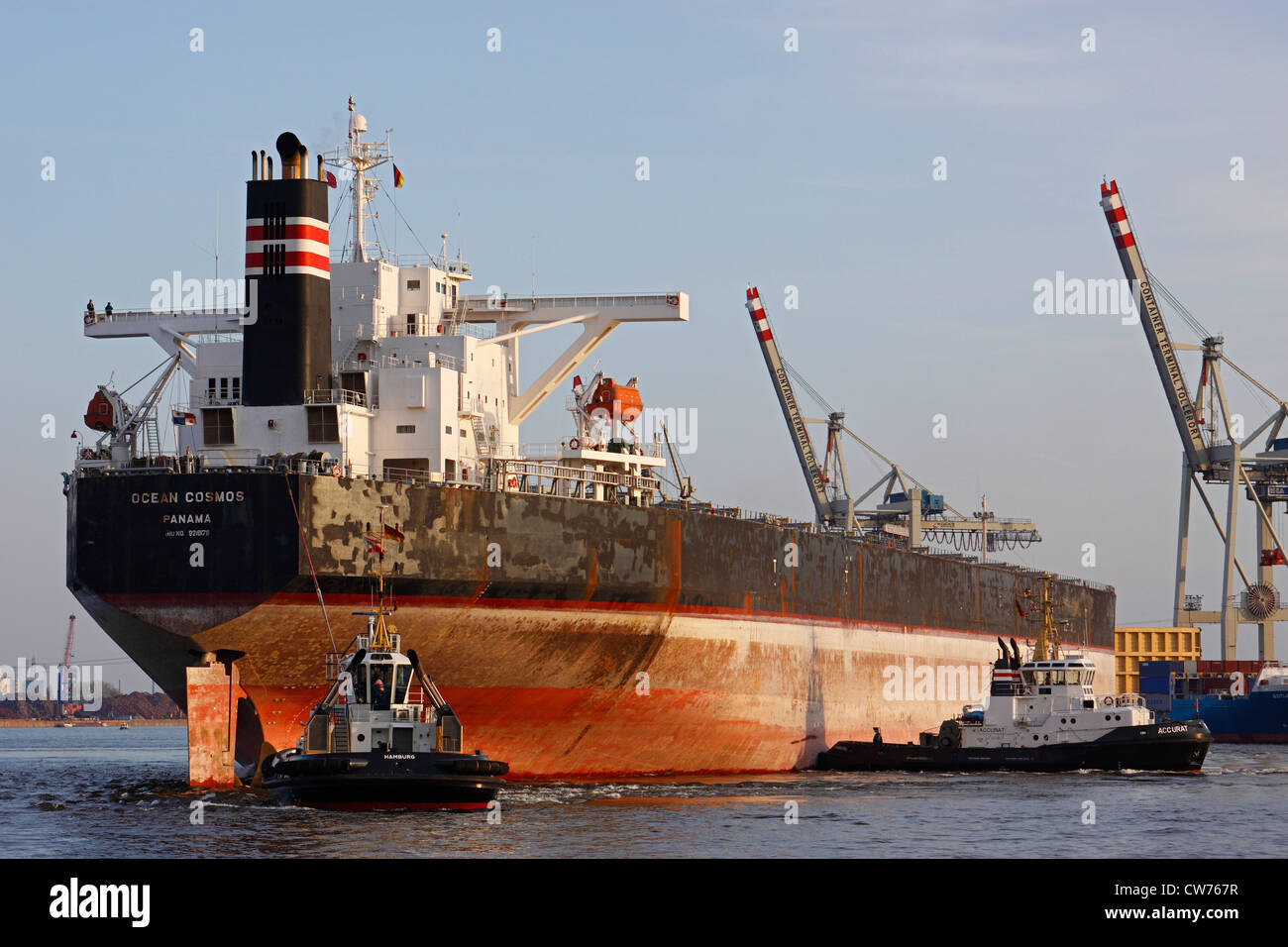transport ship with towboats in Port of Hamburg, Germany, Hamburg Stock Photo
