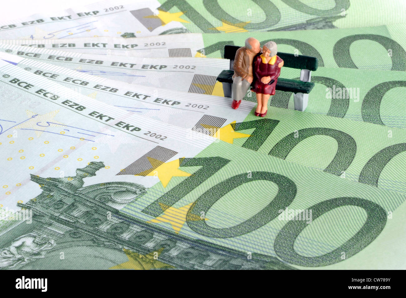 symbolic picture for pesion and provision for one's old age, little figures on bank notes Stock Photo