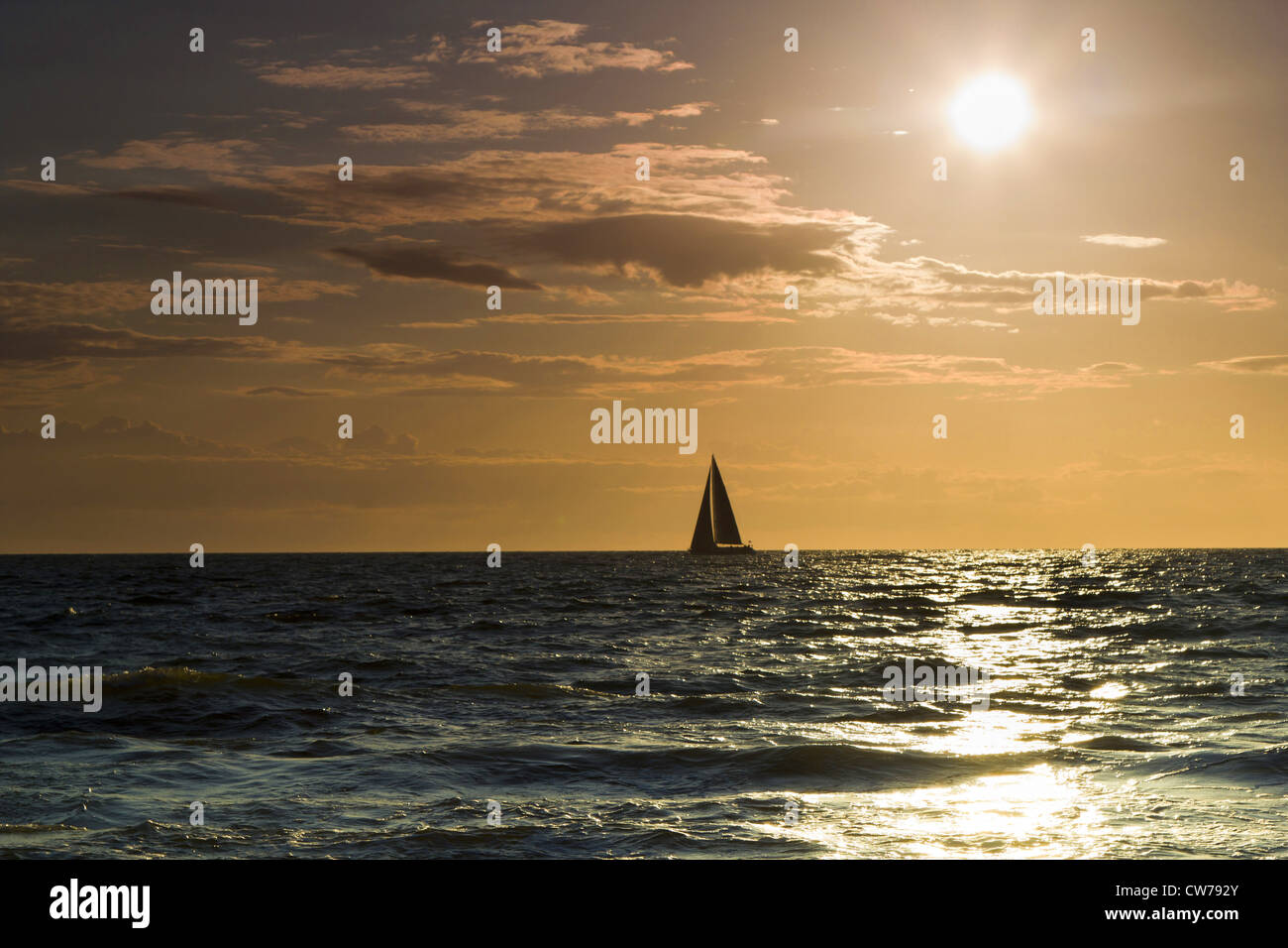 Sailing boat at sunset hi-res stock photography and images - Alamy