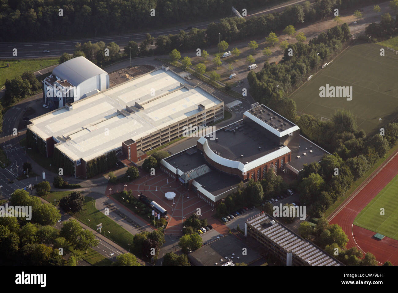 Starlight Express with parking garage, building of former cinema IMAX and highway A40 , Germany, North Rhine-Westphalia, Ruhr Area, Bochum Stock Photo