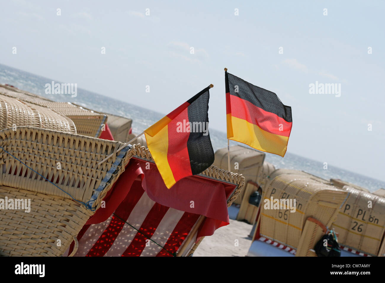 German flags on roofed wicker beach chair hires stock photography and
