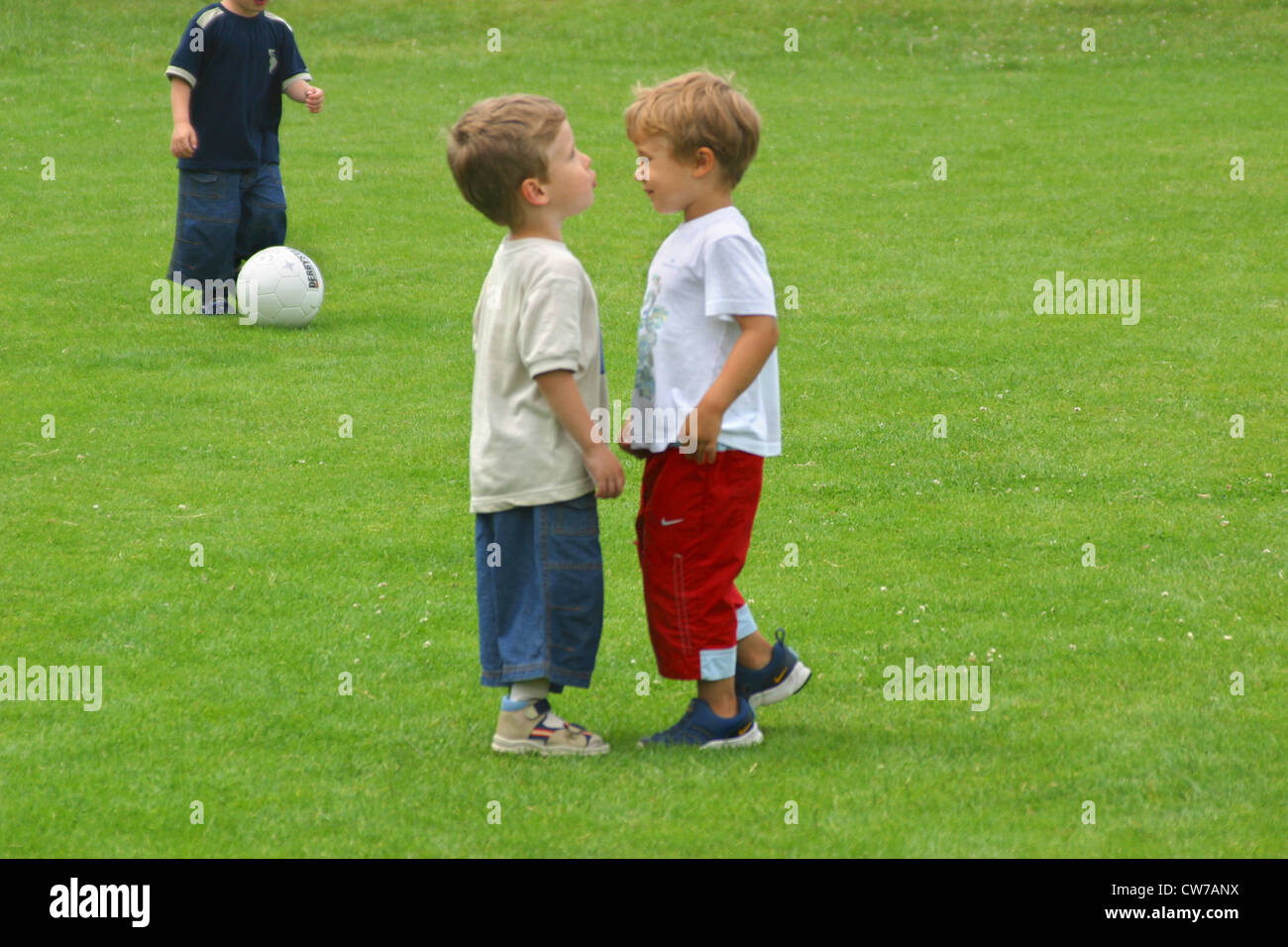two little boys on a football ground Stock Photo