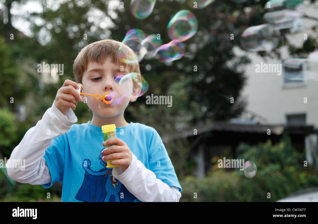 Small Boy Making Soap Bubbles Germany Stock Photo Alamy