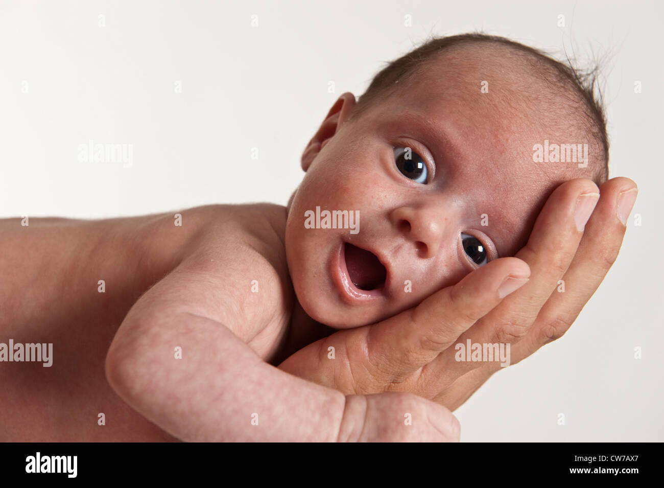 baby in the arms of the father Stock Photo