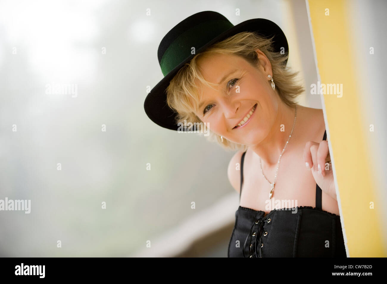 lucky woman with hat, portrait Stock Photo - Alamy