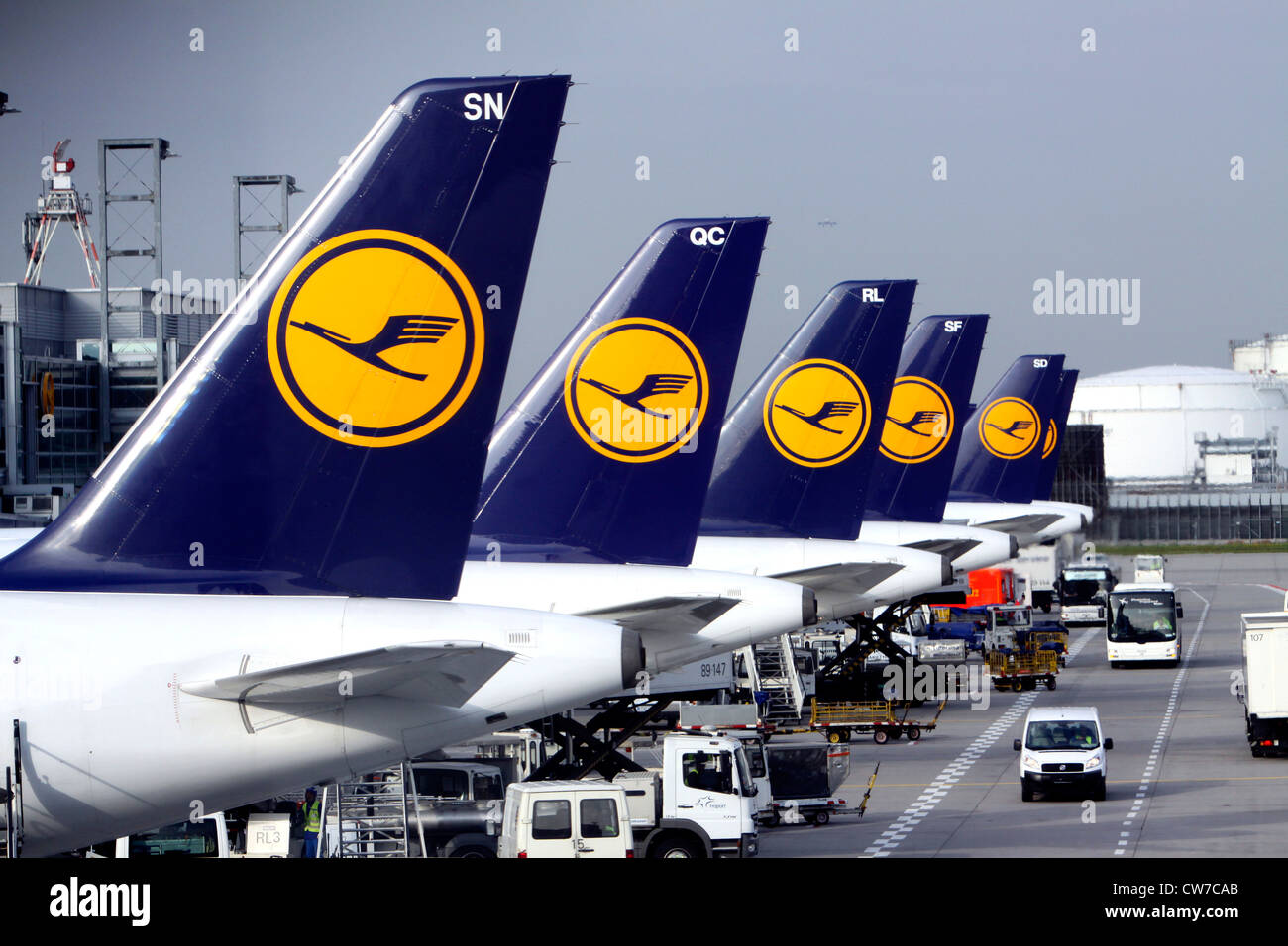 tailpieces of a jet aircraft fleet side by side at an airport terminal, Germany, Hesse, Frankfurt Stock Photo