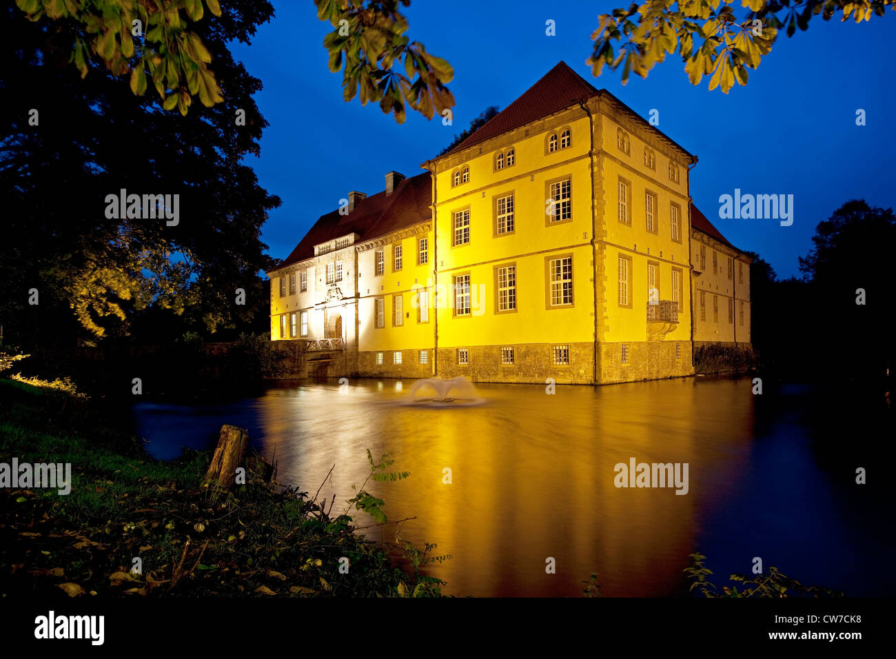 illuminated moasted castle at blue hour, Germany, North Rhine-Westphalia, Ruhr Area, Herne Stock Photo