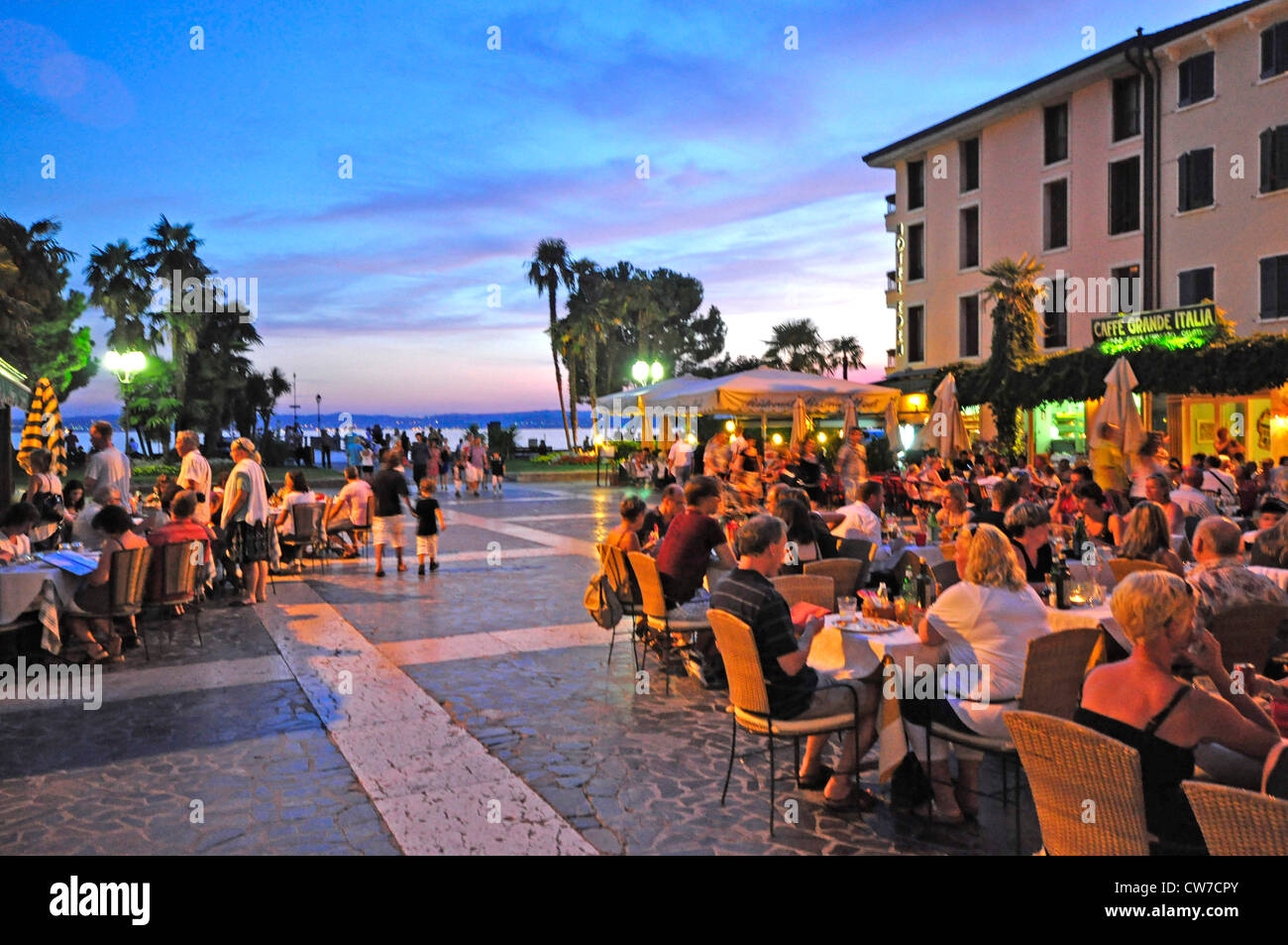 well-attended street cafes at a promenade at Lake Garda, Italy, Trentino-Suedtirol, Lake Garda, Sirmione Stock Photo