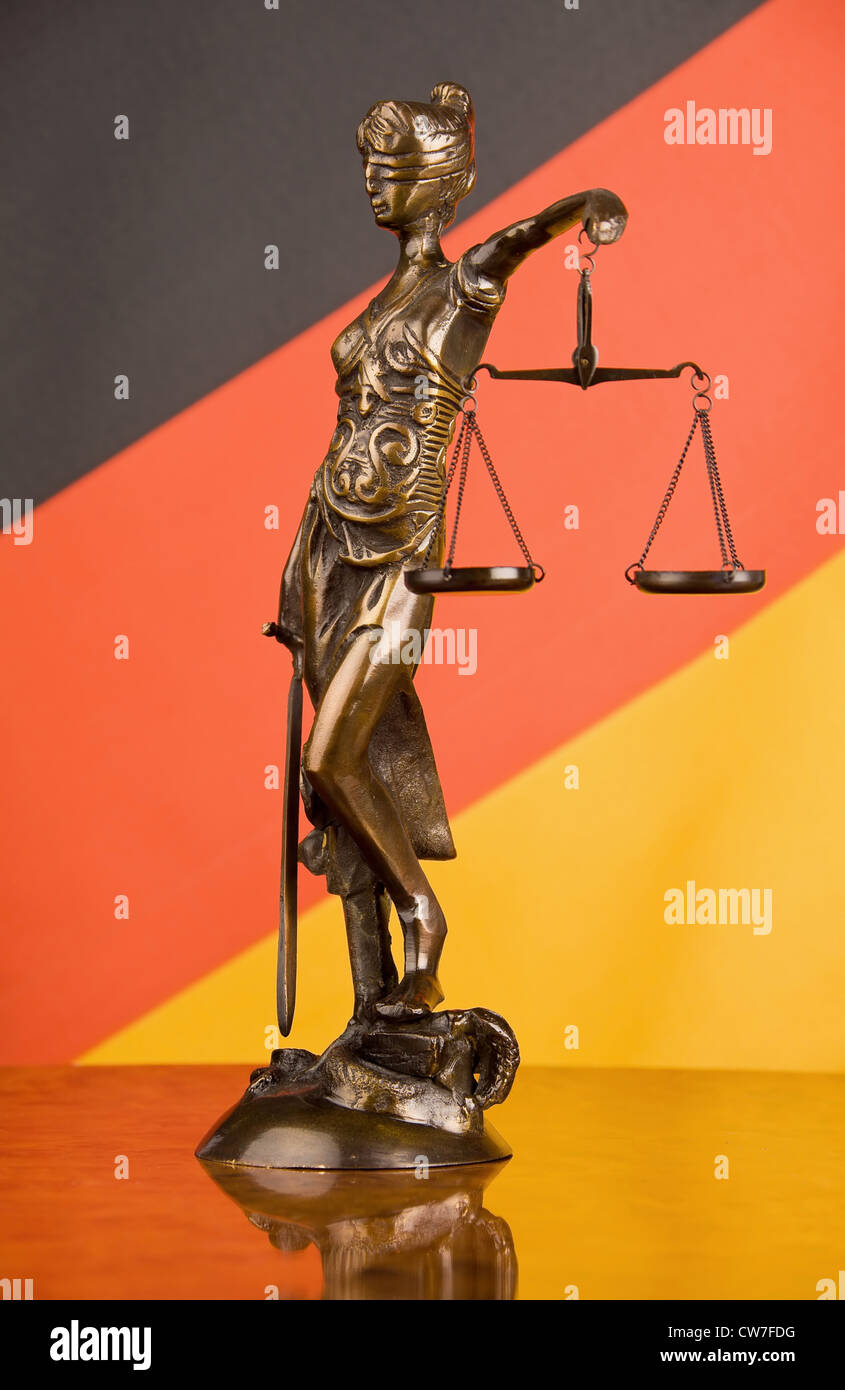Lady Justice in front of German flag Stock Photo Alamy
