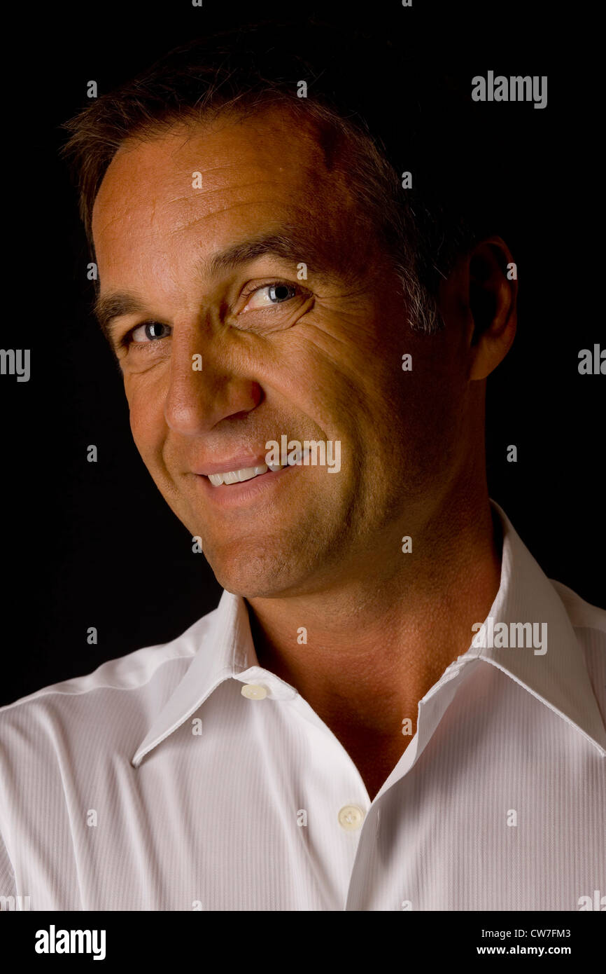 Old businessman with a white shirt Stock Photo