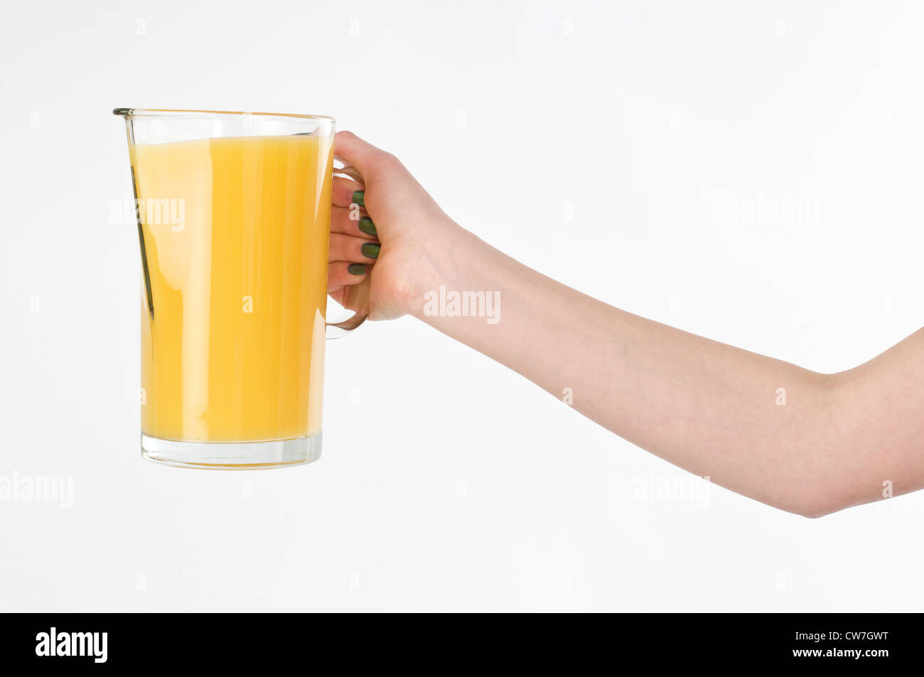 Girl holding a carafe of orange juice Stock Photo Alamy