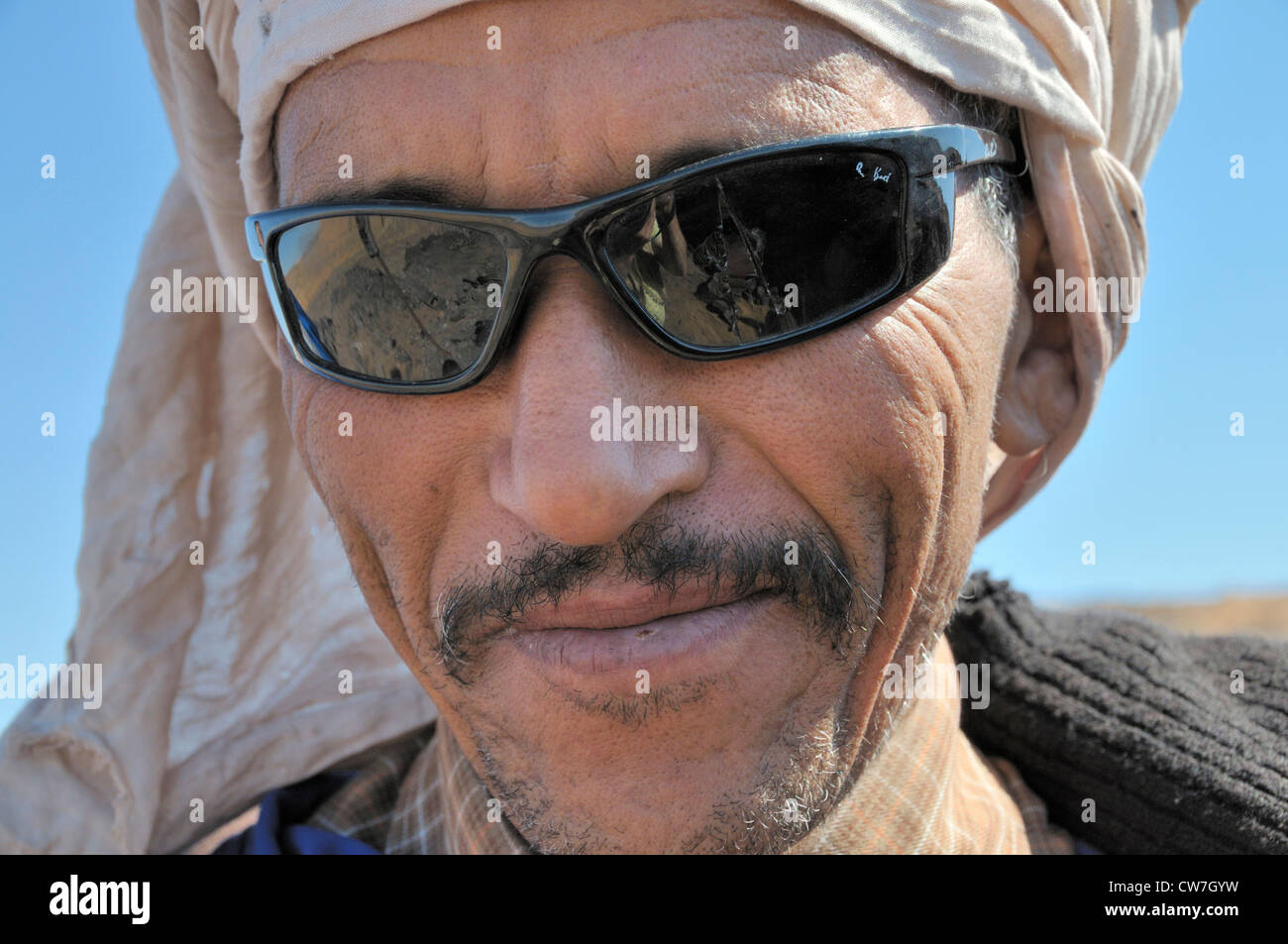 berber with traditional tagelmust and sunglasses, portrait, Morocco, Erg Chebbi Stock Photo