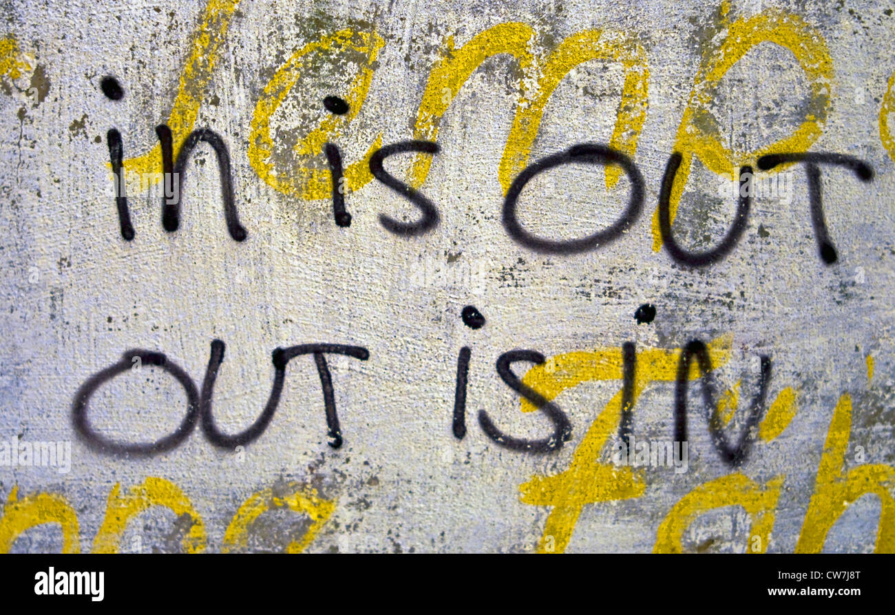 graffiti on facade saying 'in is out - out is in', Germany Stock Photo