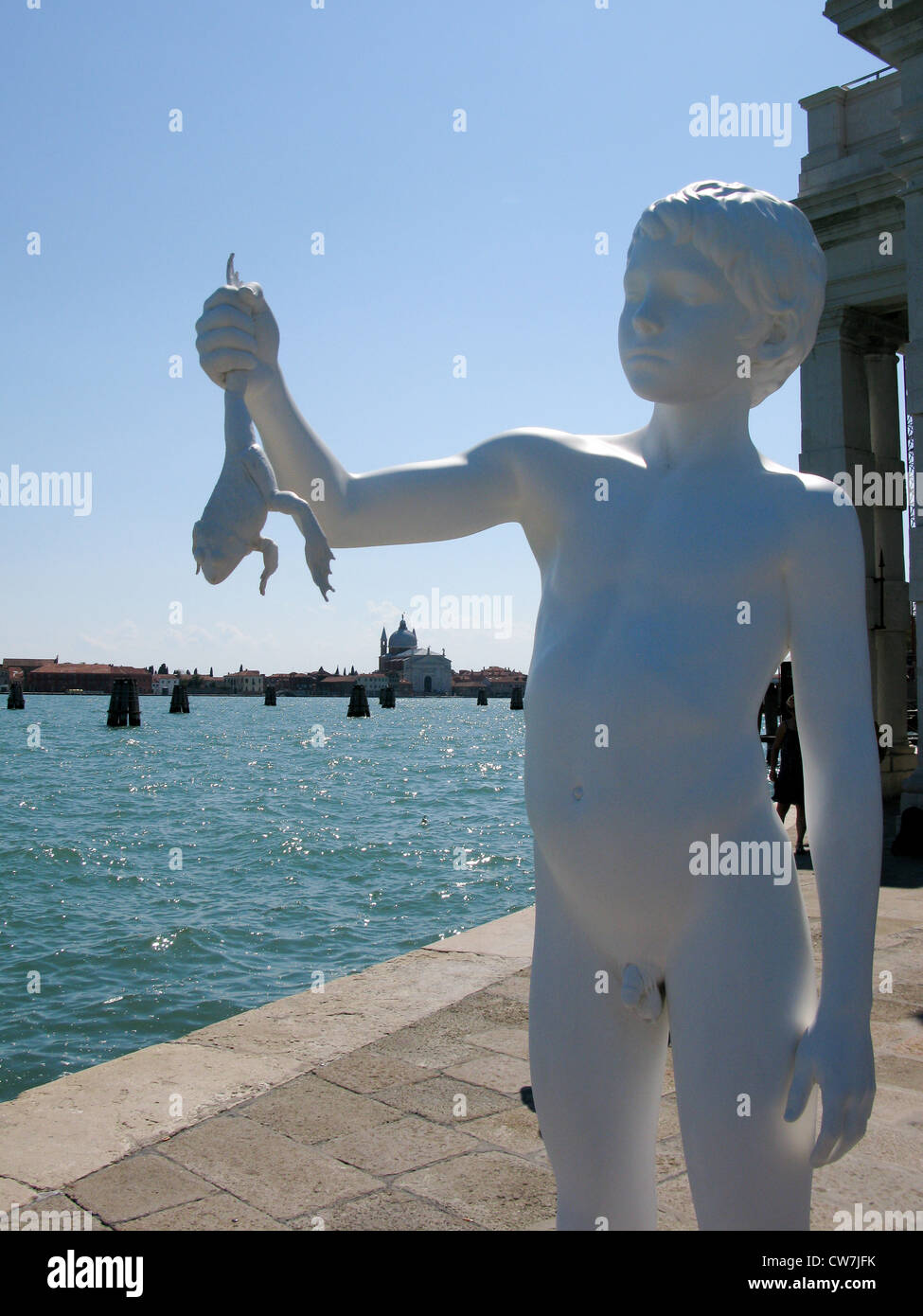 Boy with Frog Statue situated at the tip of the Punta della Dogana Stock Photo