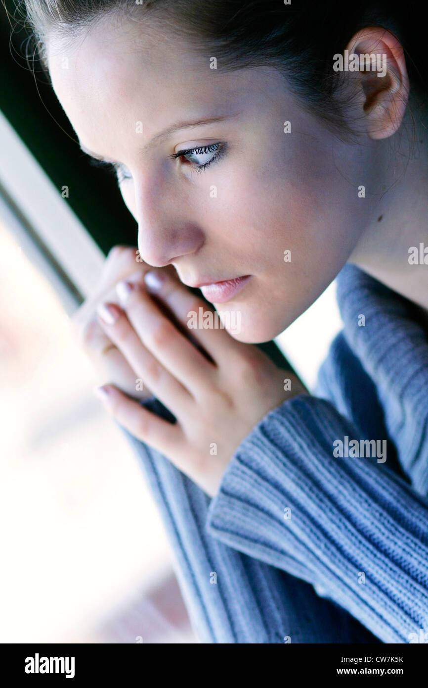 young absent-minded woman looking out of the window Stock Photo - Alamy