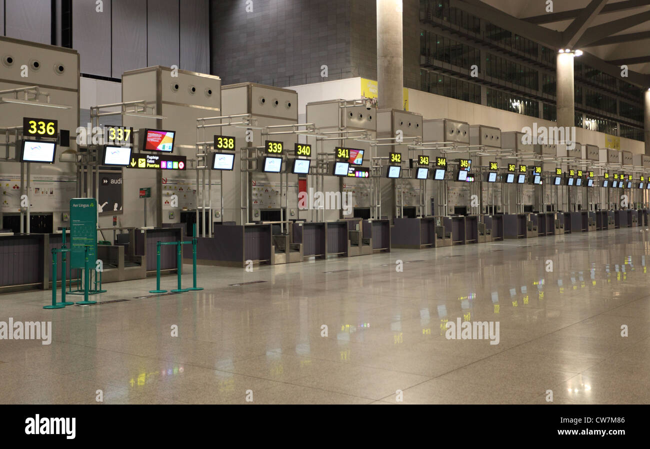 Empty airport check-in counters in Malaga, Spain. Stock Photo