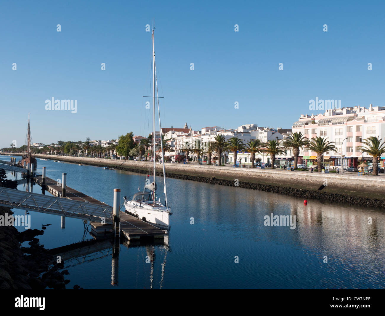Boat docked on the Ribeira de Bensafrim leading to the marine at Lagos, Portugal. Stock Photo
