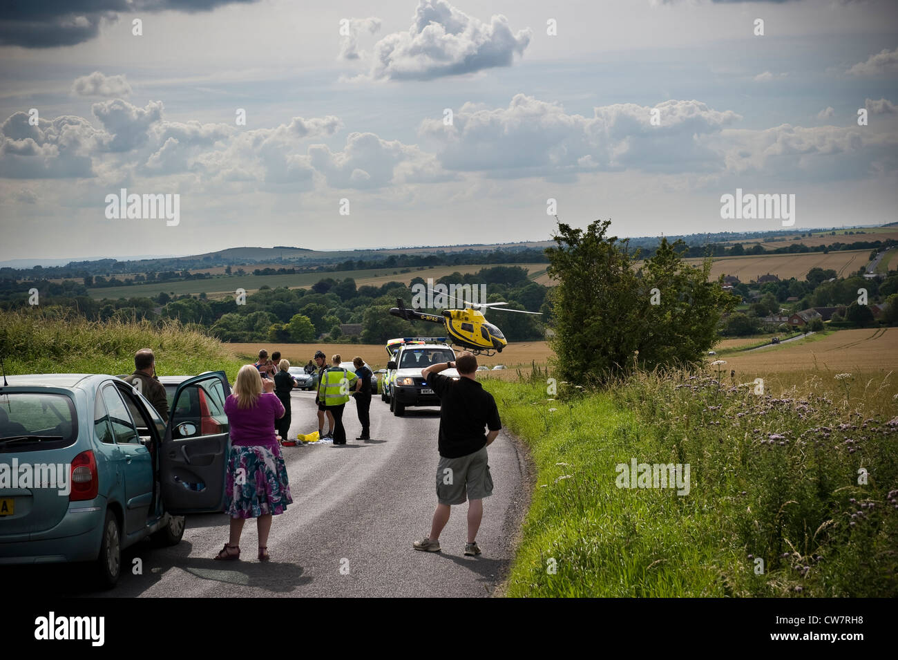 Emergency Services helicopter taking off after a cycling accident near Pewsey, Wiltshire, UK Stock Photo