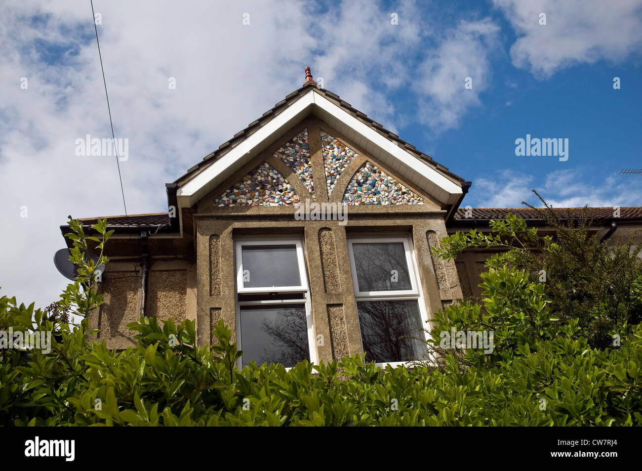 Unusual Edwardian house with gables decorated with broken pieces of ceramic crockery in Worthing, West Sussex, UK Stock Photo