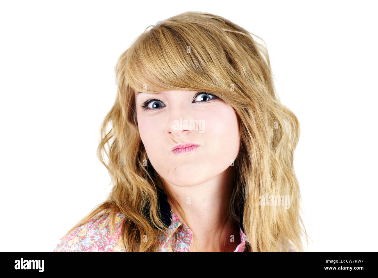 Cute Young Blond Teenager Girl Making A Funny Unhappy Or Upset Face Studio Shot On White Cute Young Blond Teenager Girl Making A Funny Unhappy Or Upset Face Studio Shot On White