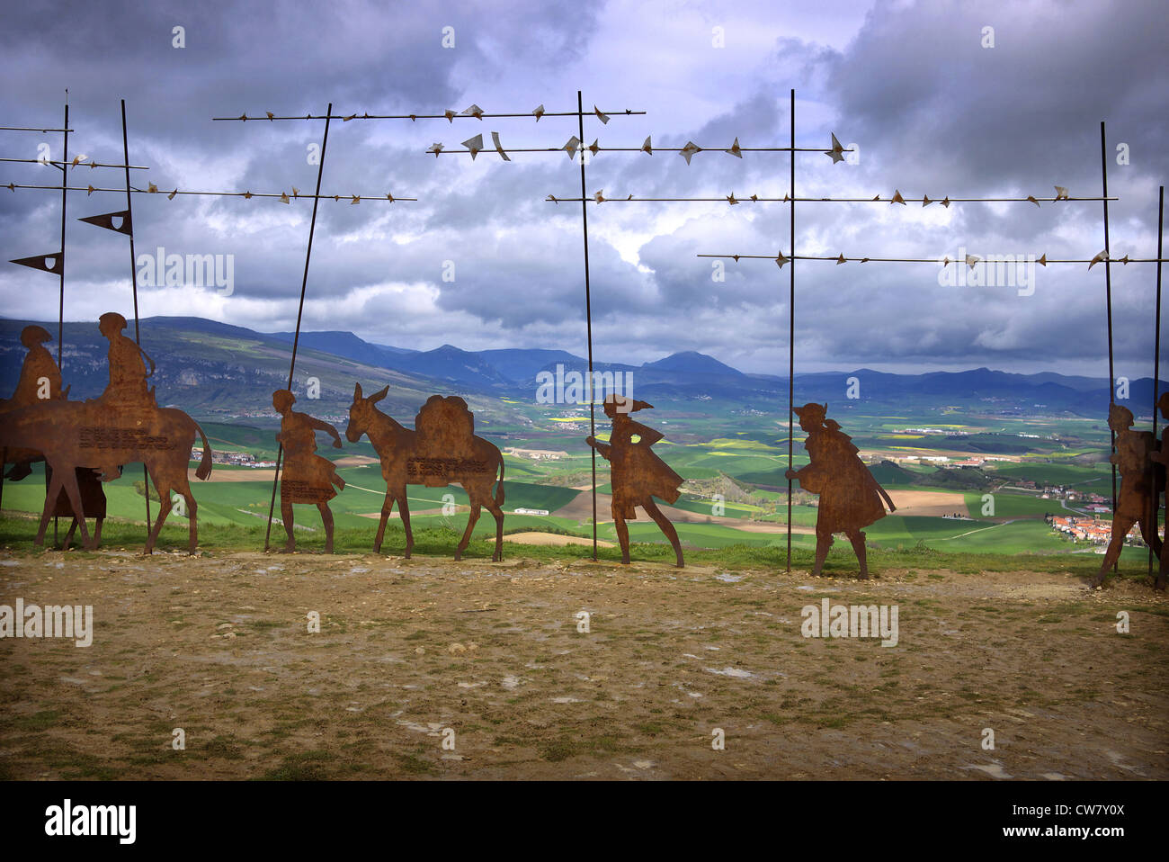 Alto del Perdon and the wrought iron sculpture of medieval pilgrims heading to Santiago de Compostela near Uterga in Spain. Stock Photo