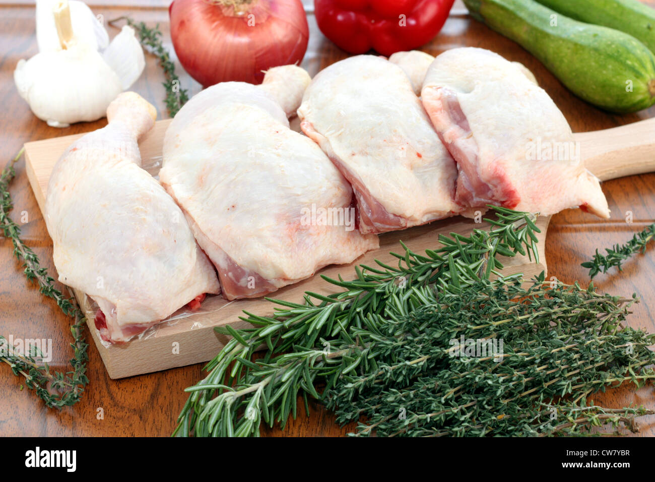 Raw chicken thighs ready to be cooked into a casserole Stock Photo - Alamy