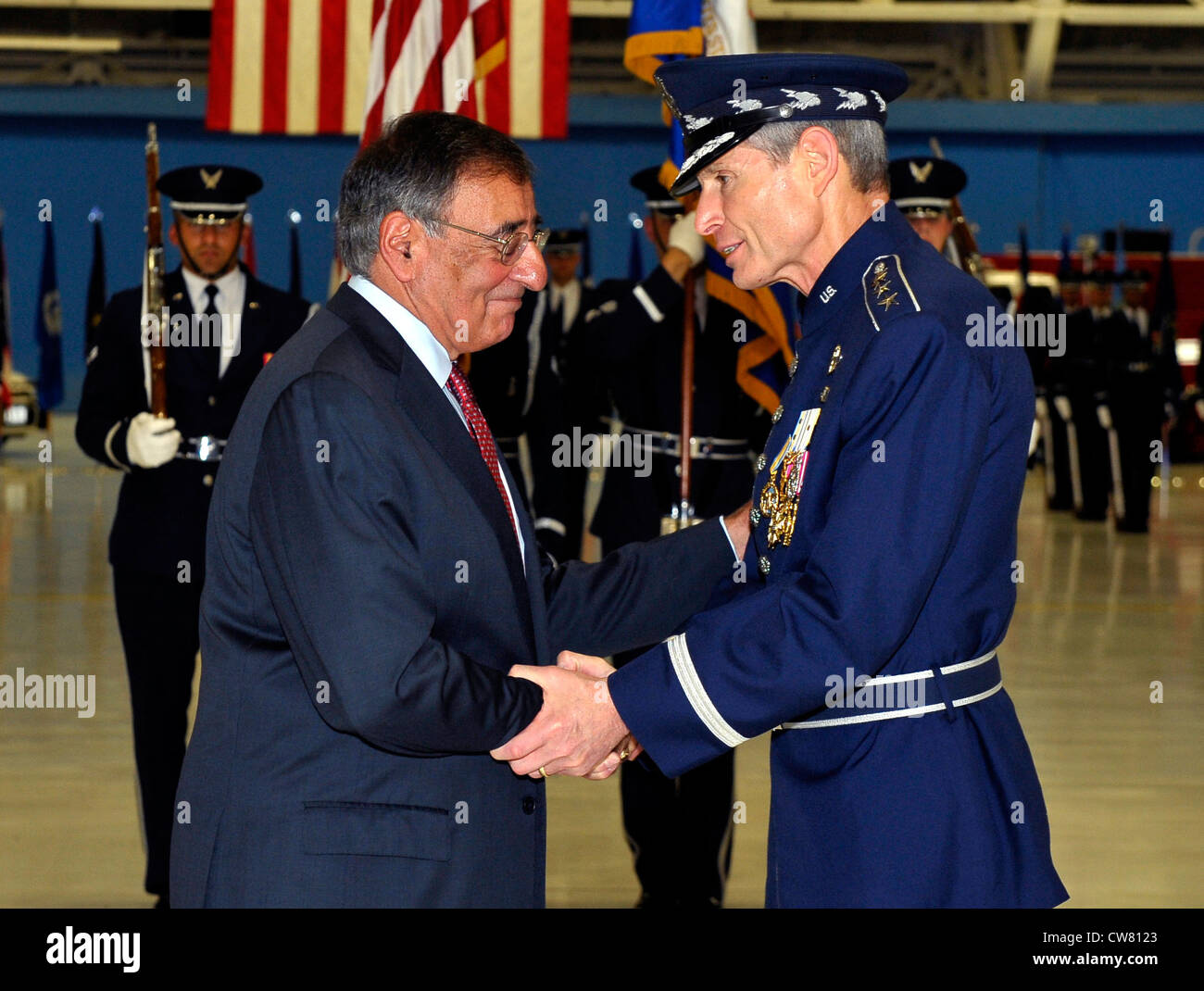 Secretary of Defense Leon Panetta congratulates Gen. Norton Schwartz on retirement during a ceremony at Joint Base Andrews, Md., on Aug. 10, 2012. Schwartz served as Air Force Chief of Staff for four years and was succeeded by Gen. Mark A. Welsh III. Welsh previously commanded U.S. Air Forces in Europe. Stock Photo