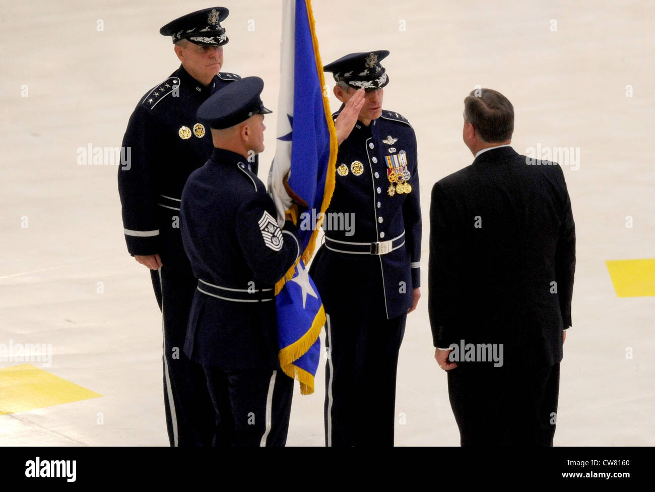 Newly appointed Air Force Chief of Staff Gen. Mark A. Welsh III salutes Secretary of the Air Force Michael Donley during a ceremony at Joint Base Andrews, Md., Aug. 10, 2012. Prior to his new position, he was the commander of U.S. Air Forces in Europe. Stock Photo