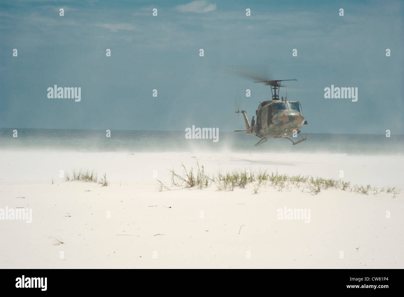 A U.S. Air Force UH1N Huey Gunship lands on the beach in Navarre