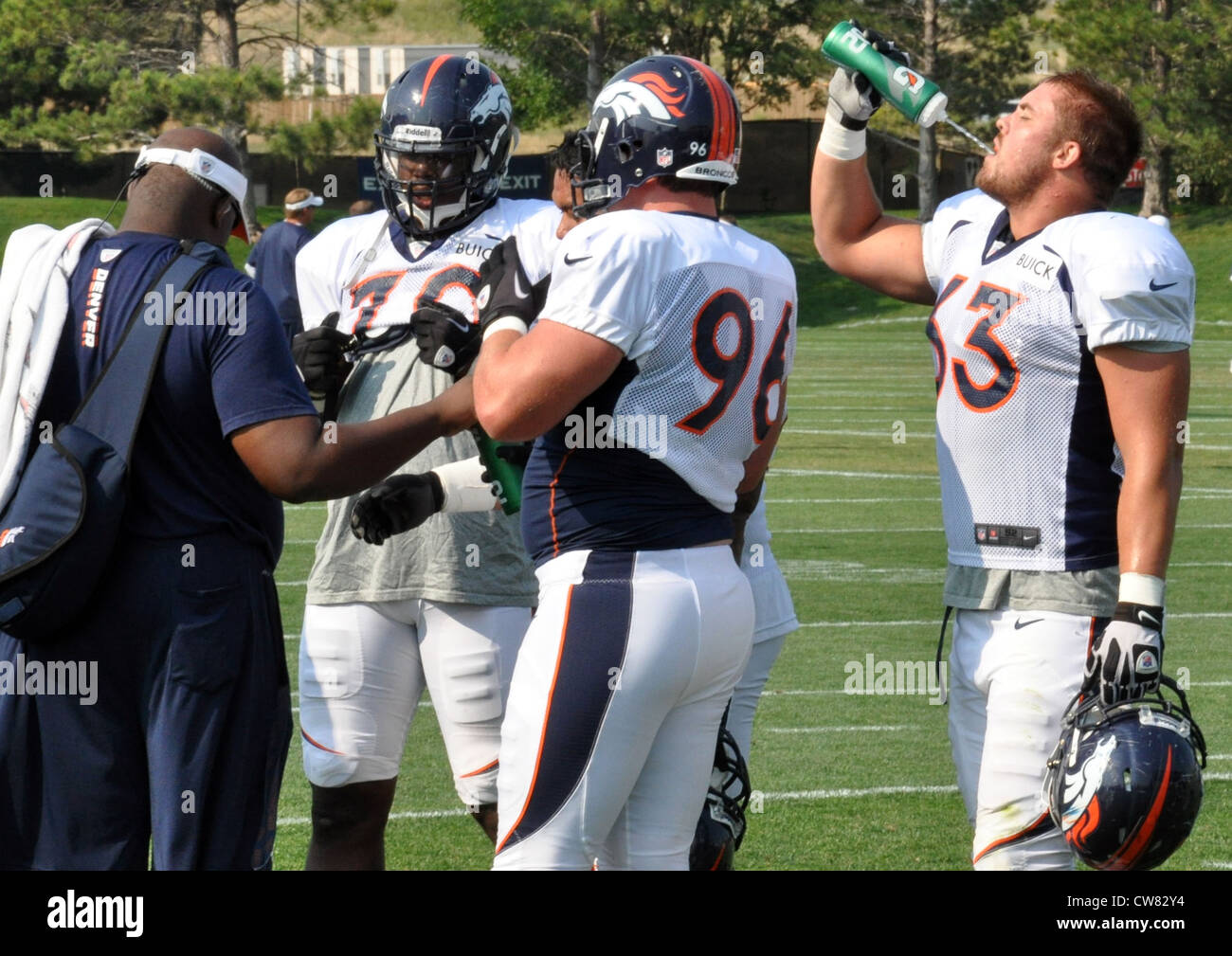 Benjamin Garland, far right, Denver Broncos defensive end, takes a
