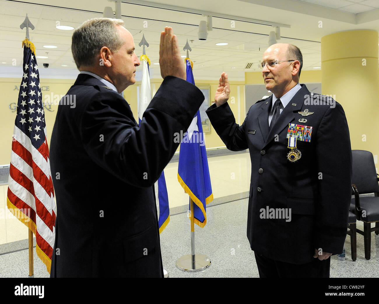 Newly-promoted Lt. Gen. James 'JJ' Jackson recites the oath of office to Air Force Chief of Staff Gen. Mark A. Welsh III during his promotion ceremony at the Pentagon, Aug. 16, 2012. Jackson is the commander of Air Force Reserve Command and the chief of the Air Force Reserve. Stock Photo