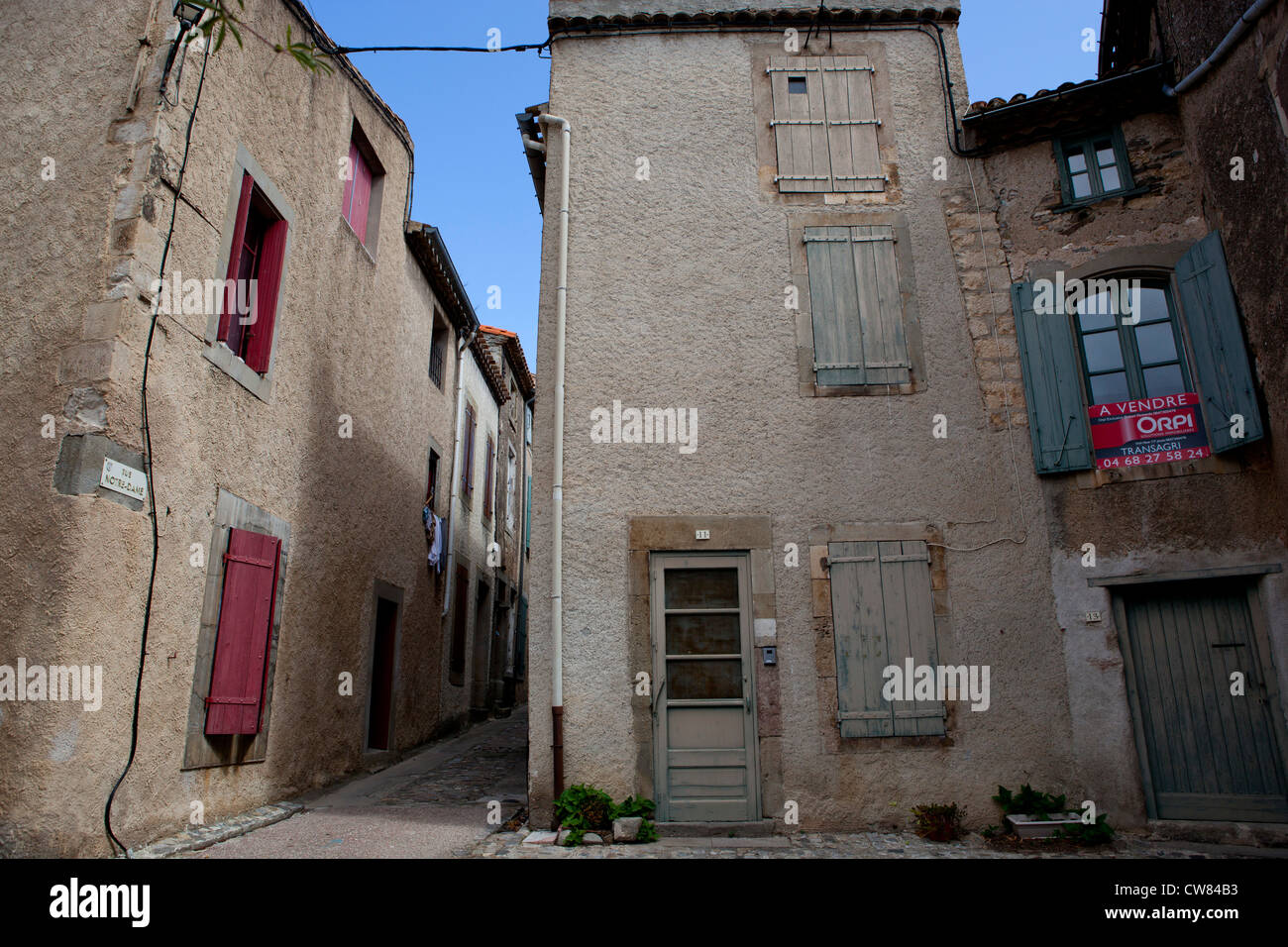 Old buildings with colourful shutters in the village of Caune-Minervois, in Southern France Stock Photo
