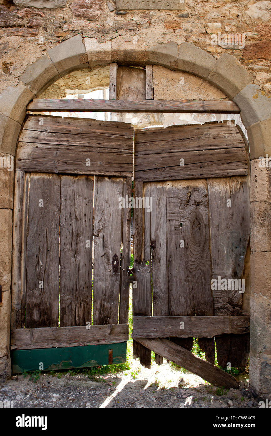 Old wooden doors in the village of Caune-Minervois in Southern France Stock Photo