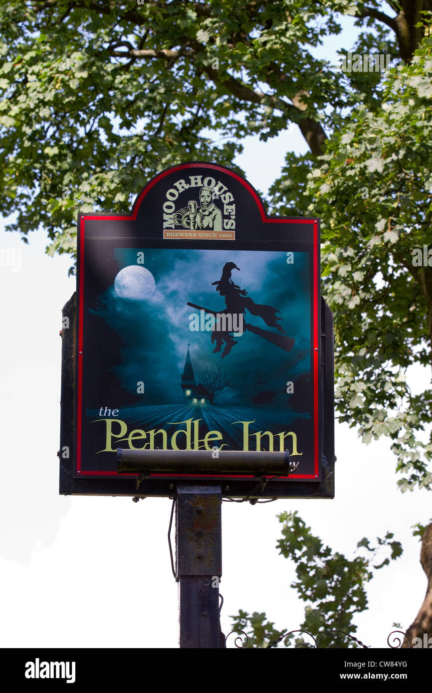 Moorhouses Pendle Hill Witches country pub sign, Flying witch on broomstick in moonlight, painted pub sign in Barley, Lancashire, UK Stock Photo