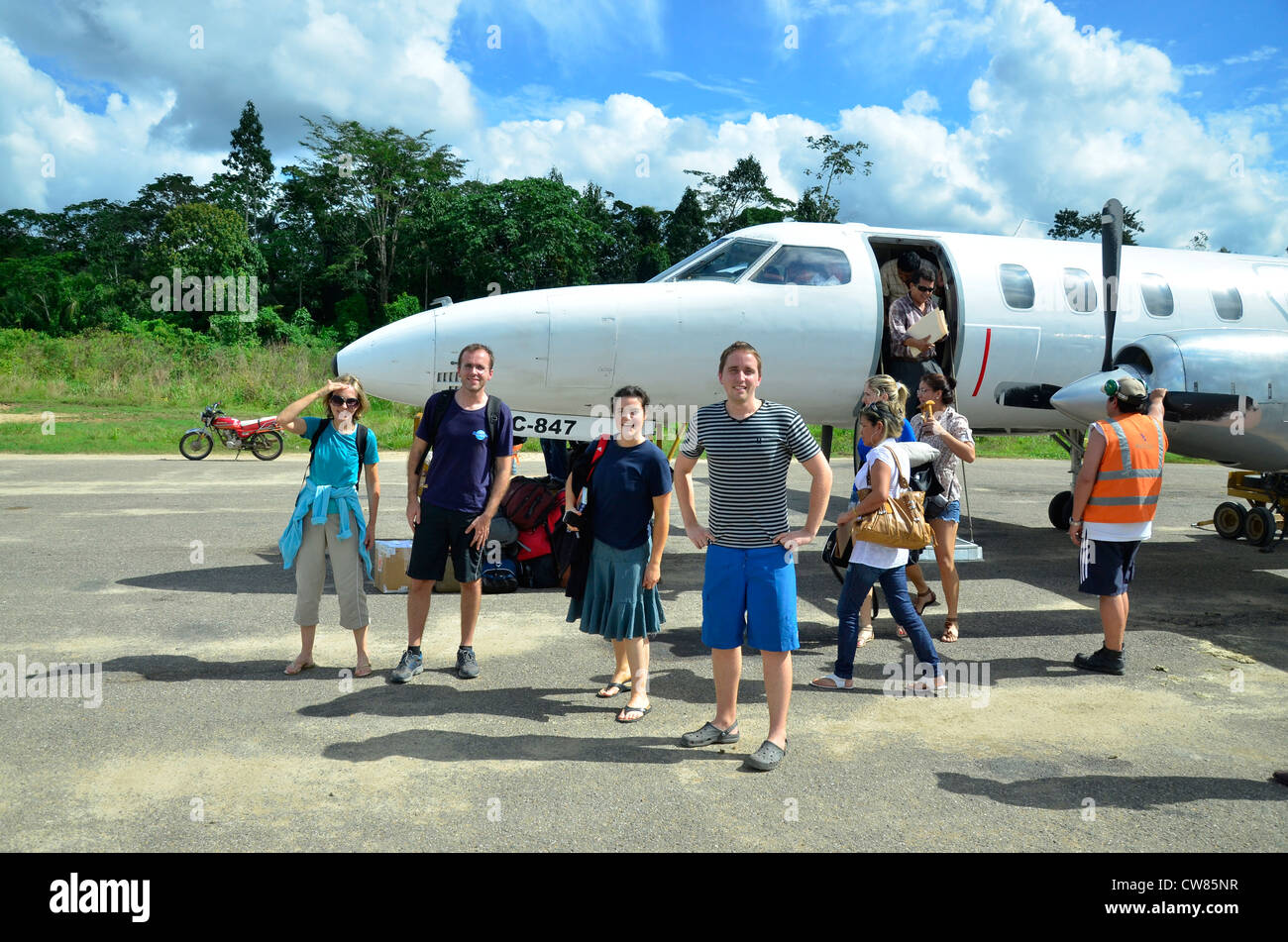 Tourists with small plane in Amazon jungle. Rurrenabaque, Bolivia, South America Stock Photo