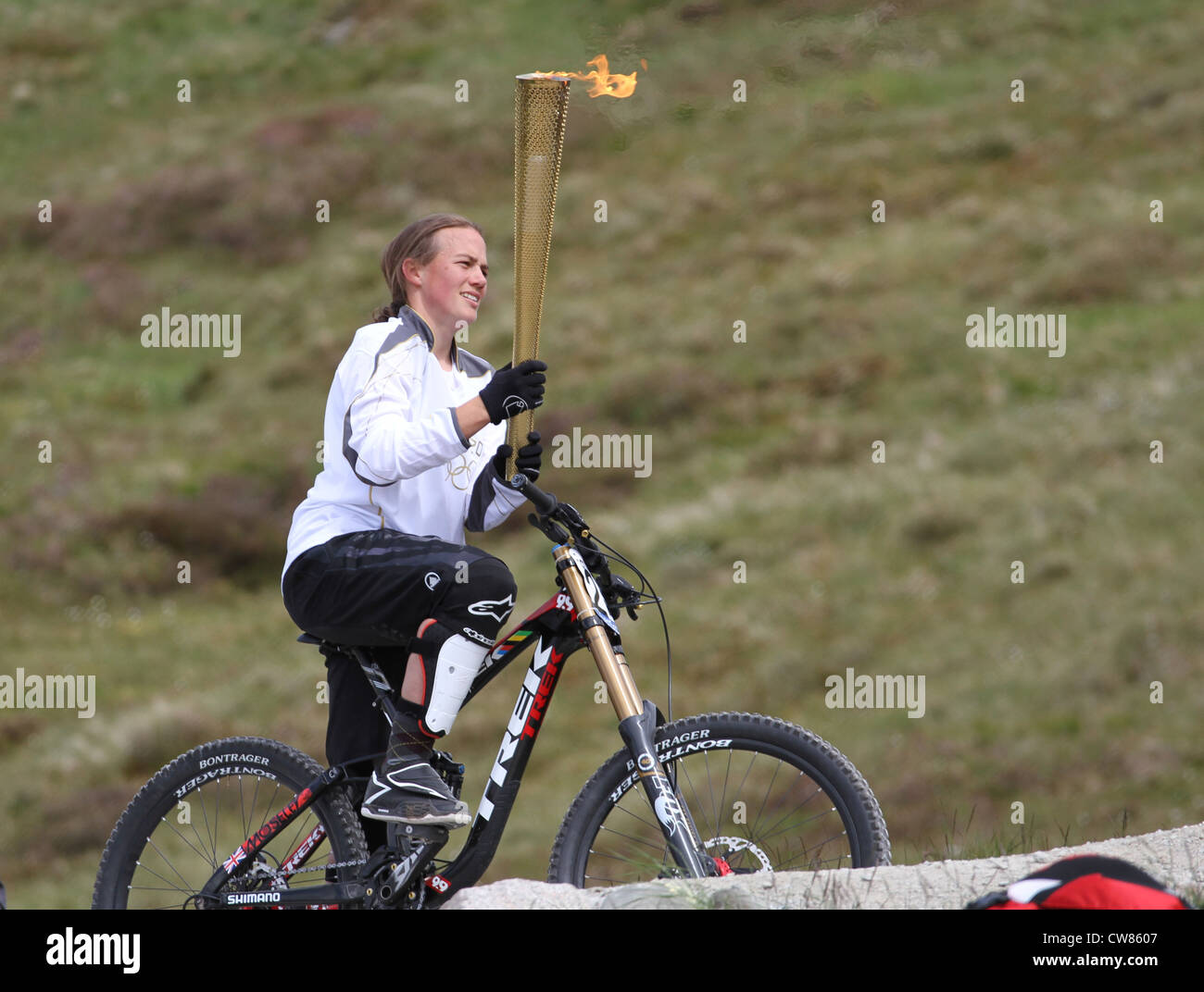 Tracy Moseley with the Olympic Torch 2012 downhill world cup at Fort William Stock Photo