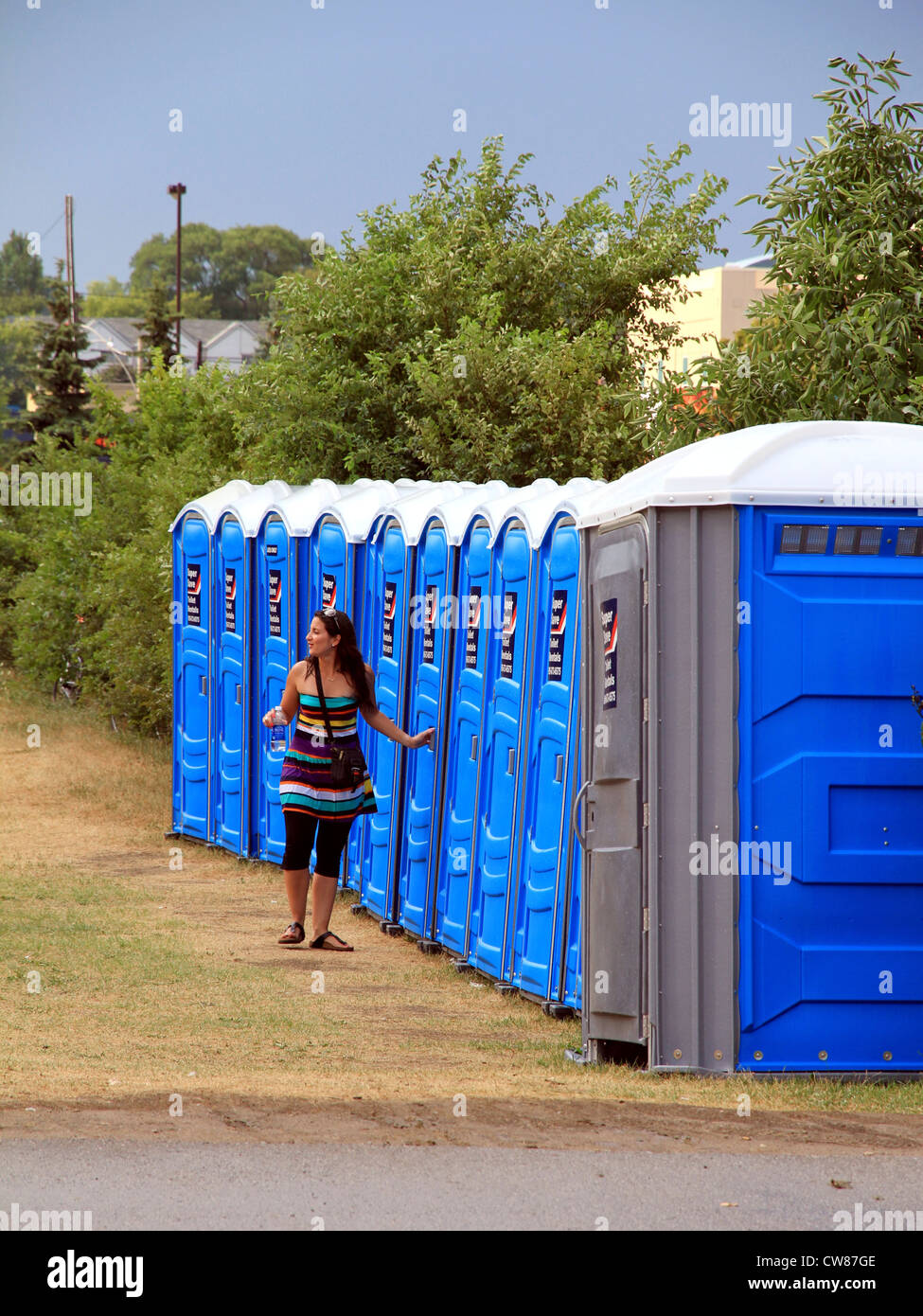 A line of portable toilets at an outdoor event Stock Photo