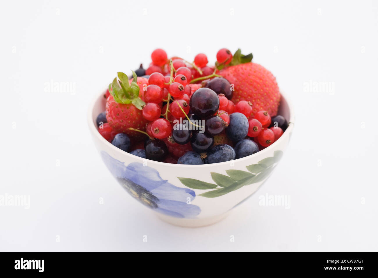 Colourful summer berries in a bowl. Stock Photo