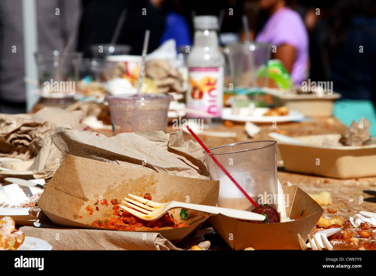 A cluttered San Francisco Street Food Festival table at the end of the day. Stock Photo