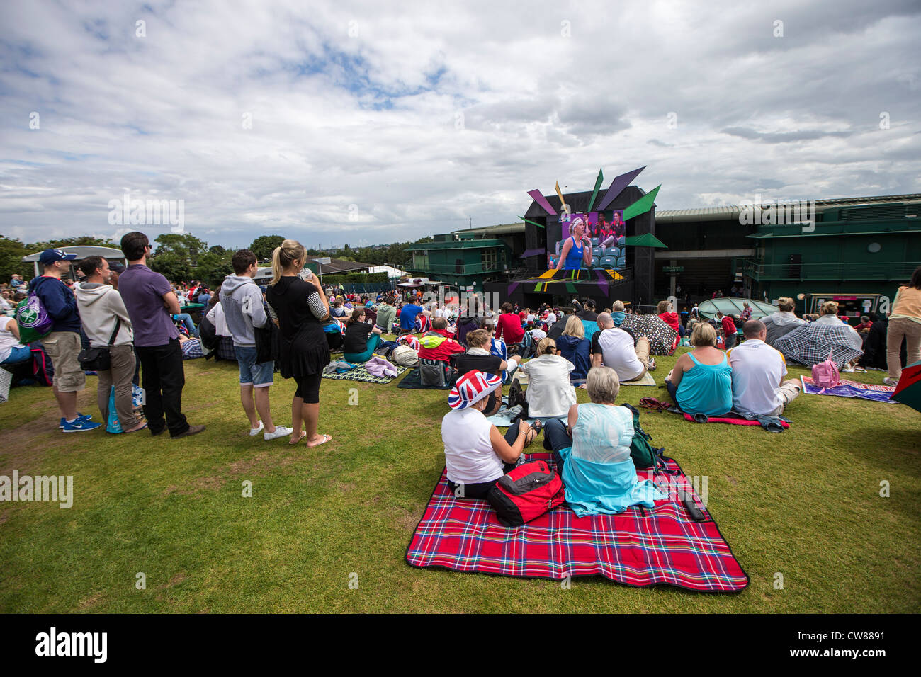Fans at Wimbledon watching the Women's Tennis Double at the Olympic Summer Games, London 2012 Stock Photo