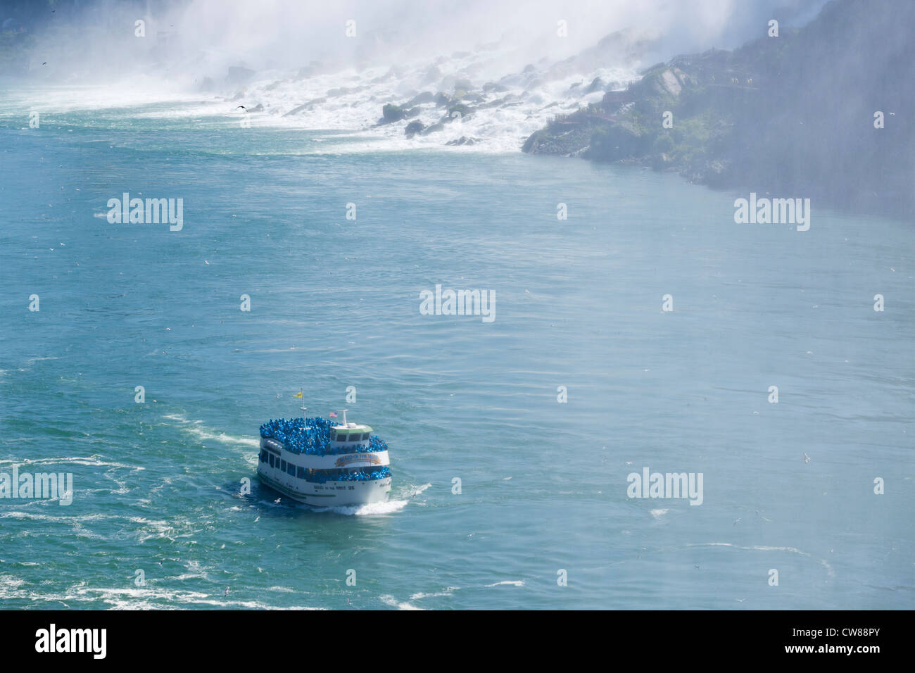 Maid of the Mist tour boat in front of the American Falls viewed from the Canadian side, Niagara Falls , Ontario, Canada Stock Photo