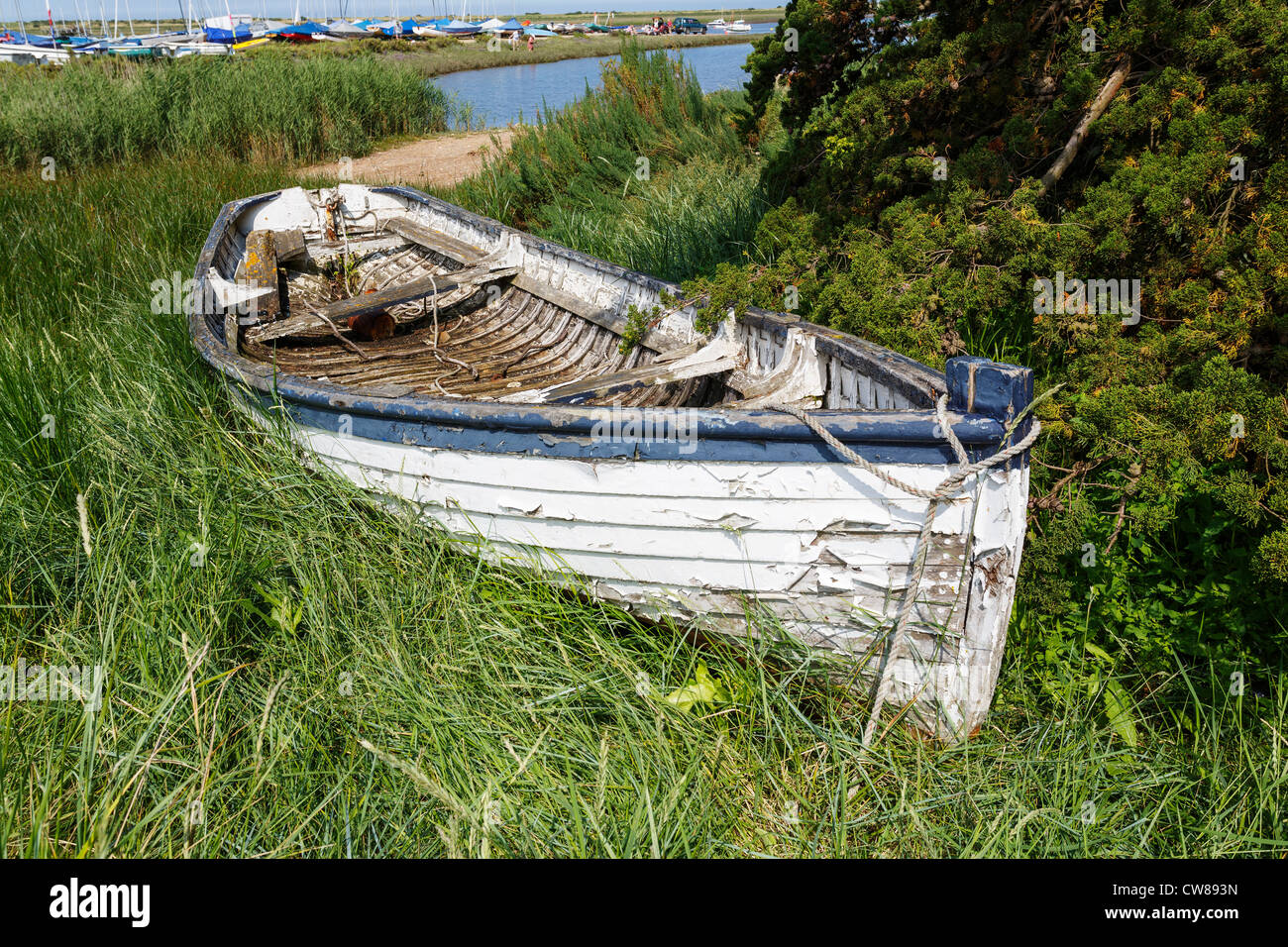 The skeleton of an old dilapidated and decaying boat left to rot on a