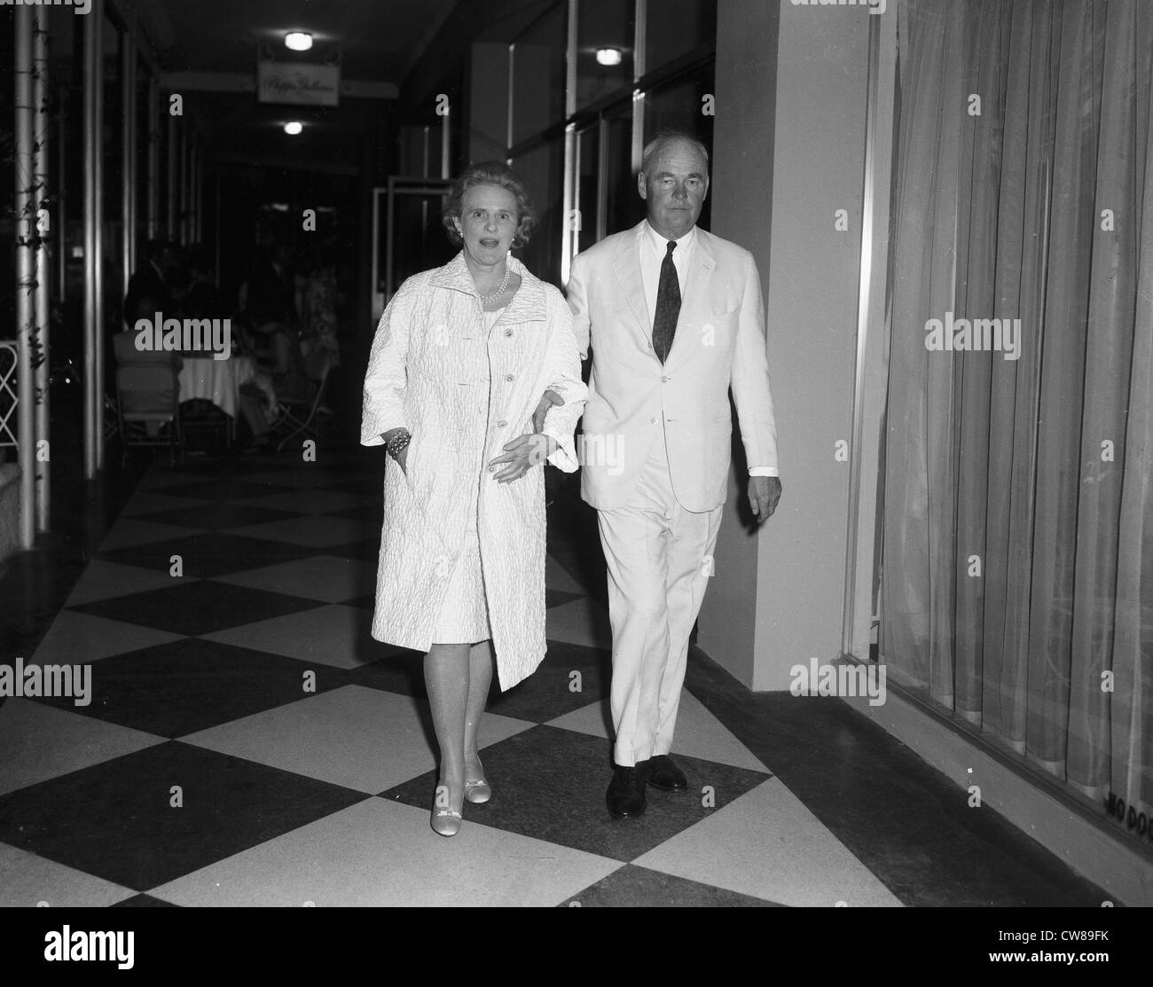 Mr & Mrs Ogden Phipps at Lillian Phipps' gallery opening, Dec. 18,1965,Palm Beach, FL. Mrs Phipps is the mother of Lily Pulitzer Stock Photo