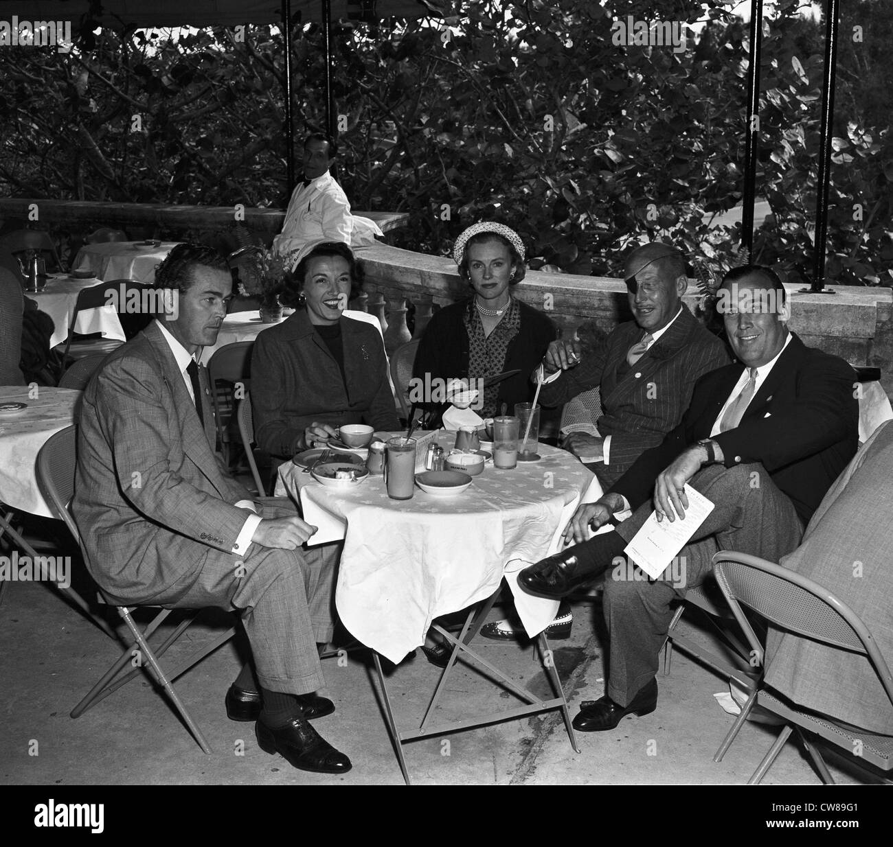 Robert Sweeney, Mrs. Dan Topping (Sonja Henie), Mrs. Winston Frost, Herbert Pulitzer and Dan Topping at Hialeah, Florida, 1949 Stock Photo