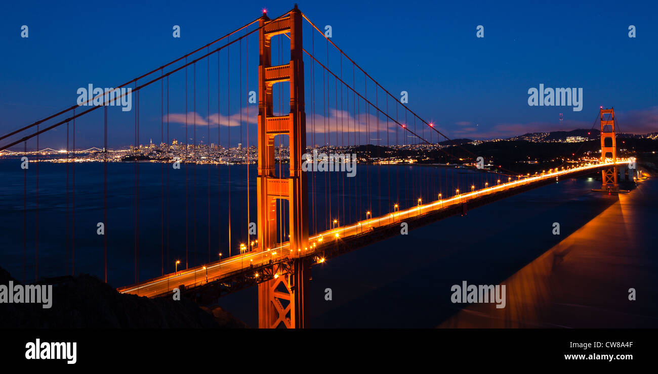 Panoramic view of the Golden Gate bridge by night in San Francisco ...