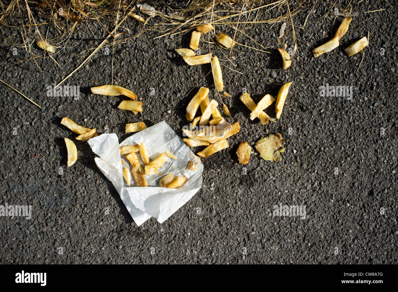 Discarded chips and wrapper Stock Photo